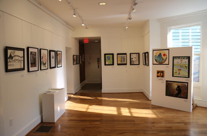 photo of art on walls for “In My View” exhibition