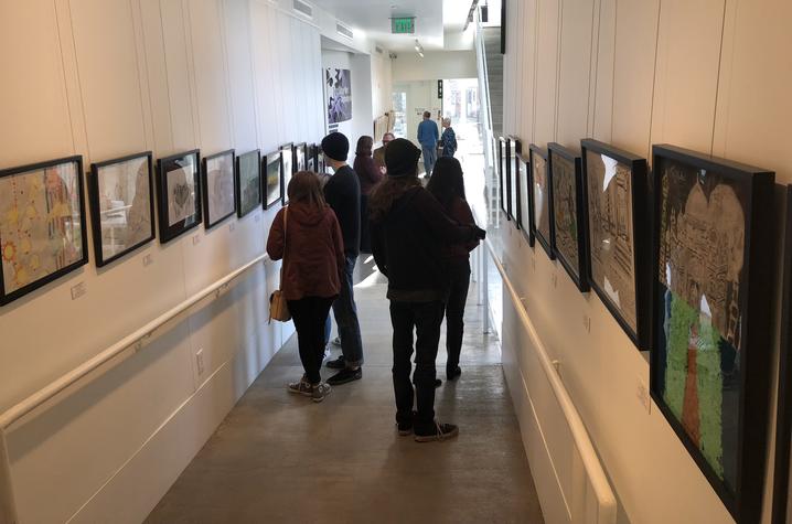 photo of people looking at art in “In My View” 