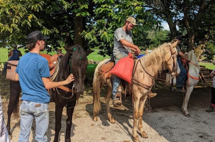 Community members loaded supplies on horseback to reach stranded flood survivors. Photo provided.