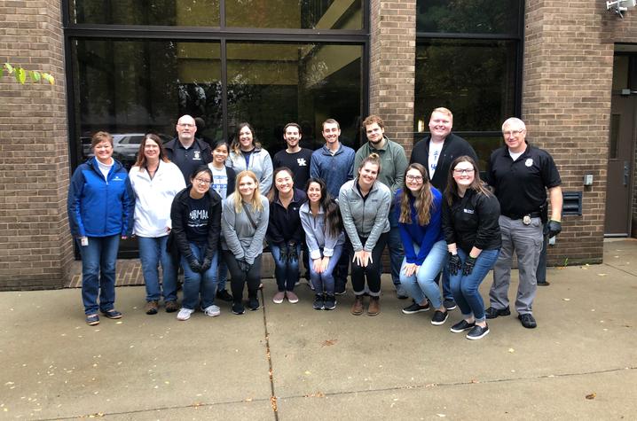 Photo of UK College of Pharmacy students with members of the Lexington Police Department