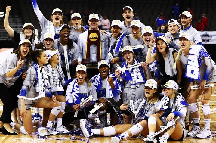 This is a photo of the UK Volleyball team upon winning the NCAA Championship. 