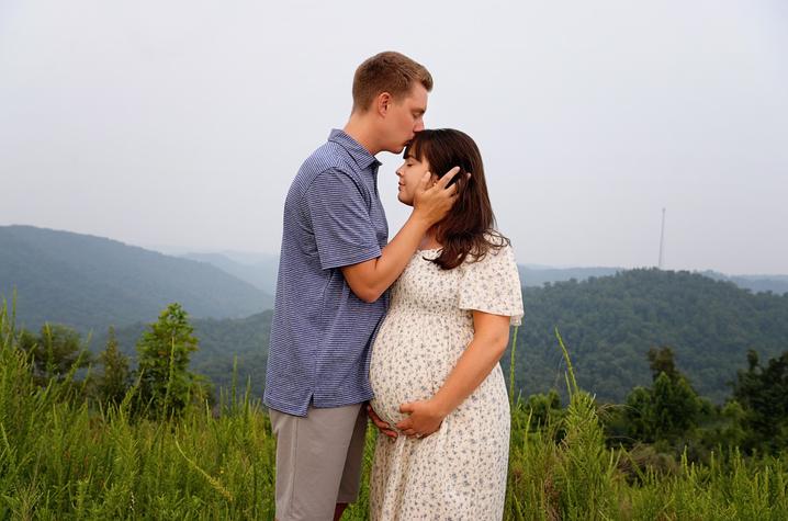 image of Andrew and Allison Brown on a mountain top