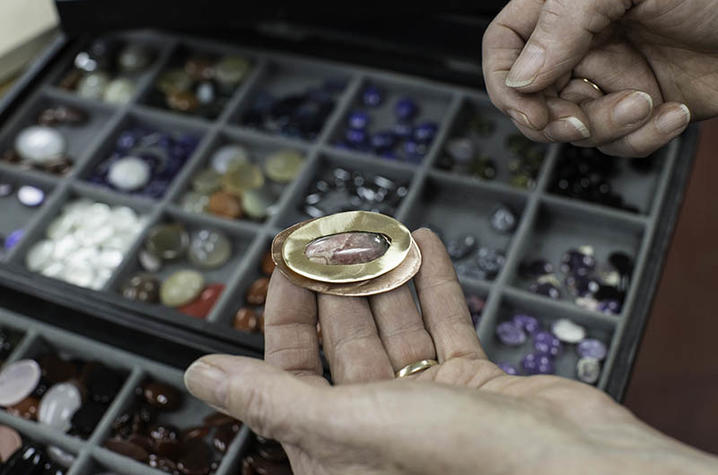 photo of hands at work in jewelry-making class at Fine Arts Institute
