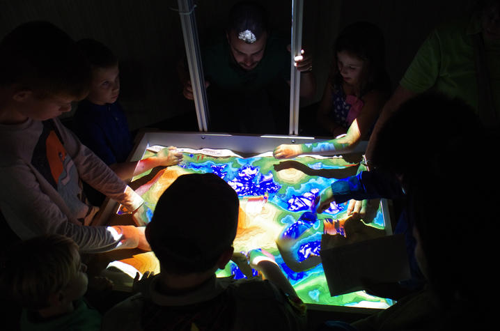 Young visitors to the 2016 open house enjoy a virtual sandbox, provided by the UK Department of Mining Engineering