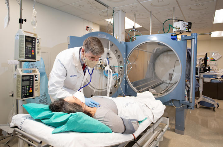 Doctor listening to patient’s heart