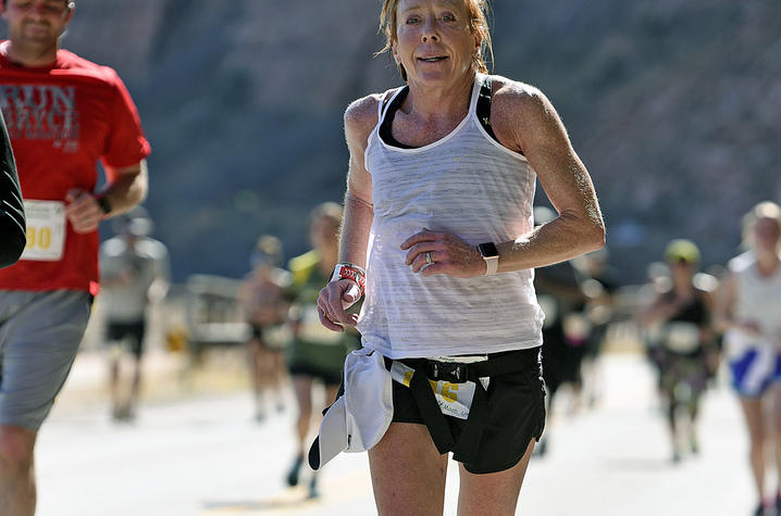 Lisa running the Moab half marathon