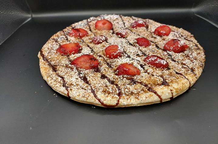 image of chocolate, strawberry and graham cracker pizza