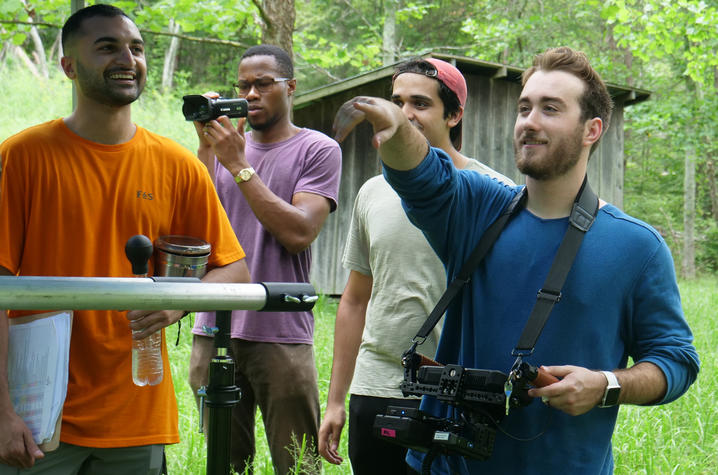 Matthew Dunlap (right) and his crew work on the set of Burning In Trial on location in the Red River Gorge.