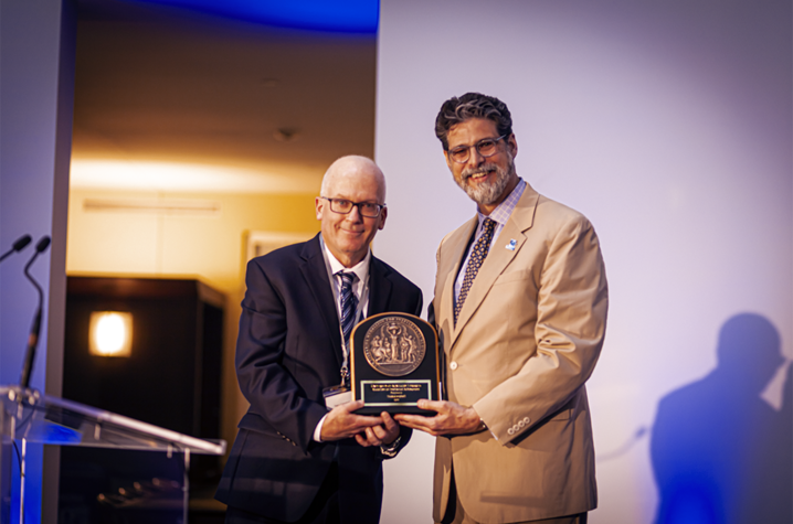 Prof. Tracy Campbell receives the award from Dean Brady