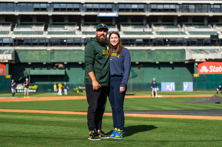 Megan and Ethan Stewart on a baseball field. 