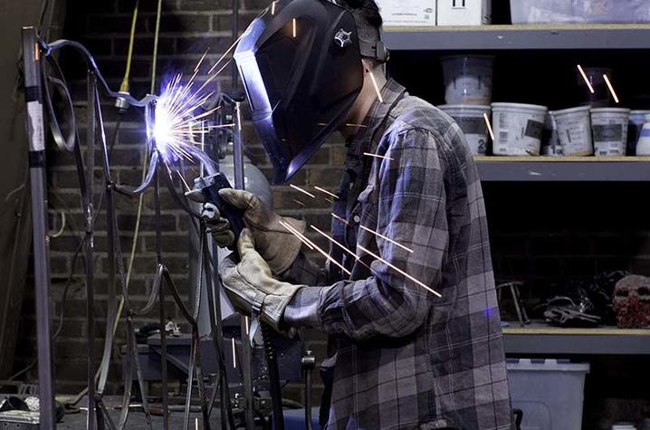 photo of student in Fine Arts Institute metalworking class