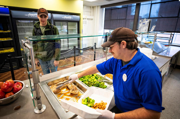 photo of student getting a meal at ONE Community Cafe
