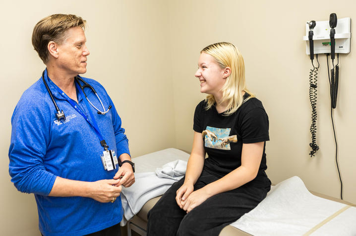 image of Annastasia Tipton with Louis Bezold, M.D. in an exam room