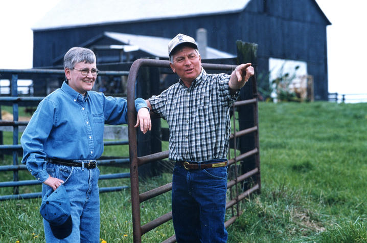 Photo of Deborah Reed in field with farmer