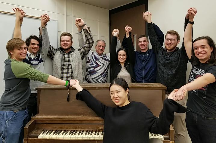 photo of students in UK's 2019 Russian singing class with pianist