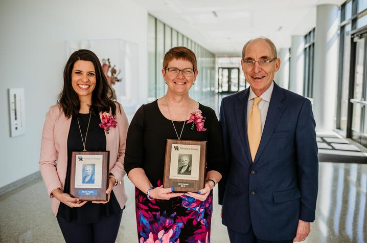 photo of 2019 Sarah Bennett Holmes Award winners Micaha Hughes and Janet Lumpp with UK President Eli Capilouto