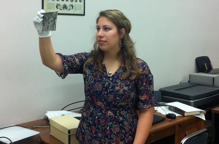 photo of Learning Lab intern in white gloves working with collection at UK Libraries