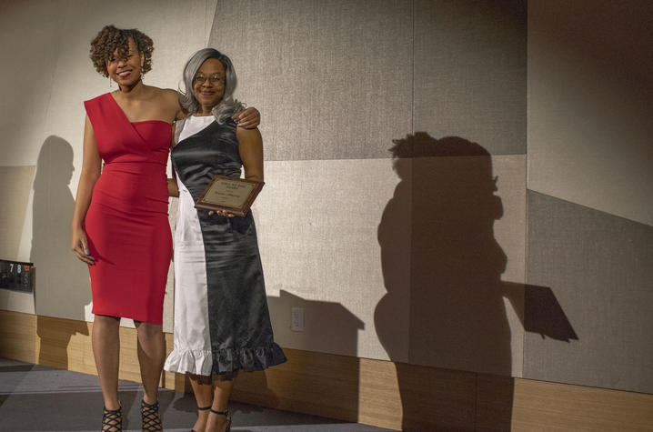 Kennedy Guess presents Brianna Armstrong with the Still We Rise award