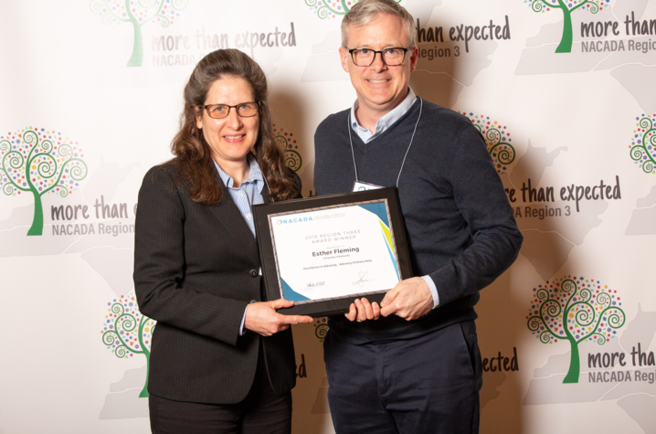 Esther Fleming receiving the NACADA Region 3 Excellence in Advising Award from Jeff Elliott, NACADA Region 3 Chair.