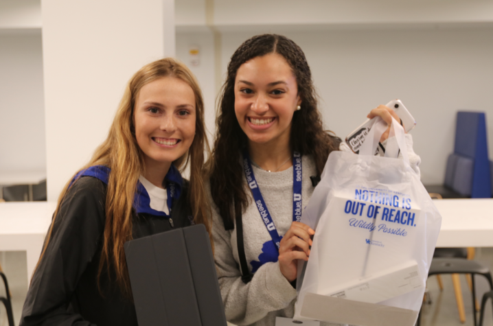 Two students posing with their iPad's.