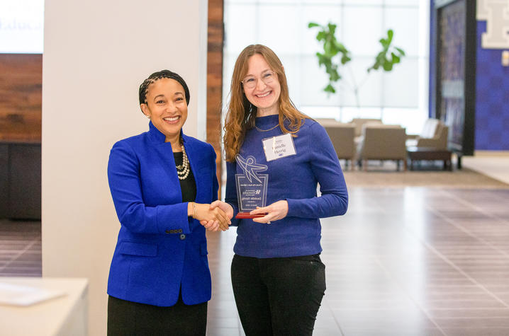 UK College of Education Acting Dean Danelle Stevens-Watkins, left, presents a Teachers Who Made a Difference Award at the February 2024 recognition ceremony. 