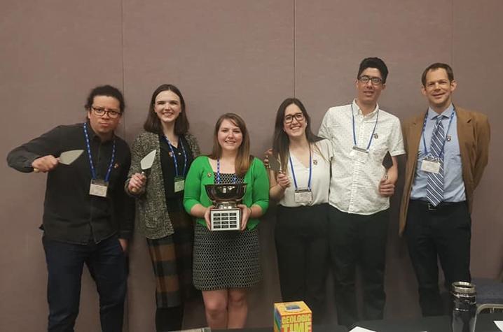 From left to right: Alberto Ortiz Brito, Gertrude Kilgore, Elizabeth Straub (holding the Ethics Bowl trophy), Gabriela Montero Mejía, Daniel Vallejo-Cáliz, and Scott Hutson. 