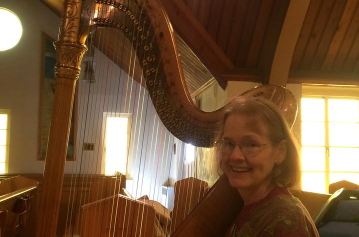 photo of Elaine Cook with Thomas Harlan's Lyon & Healy harp