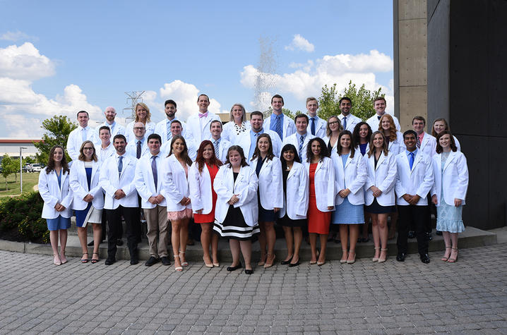 35 students in white coats