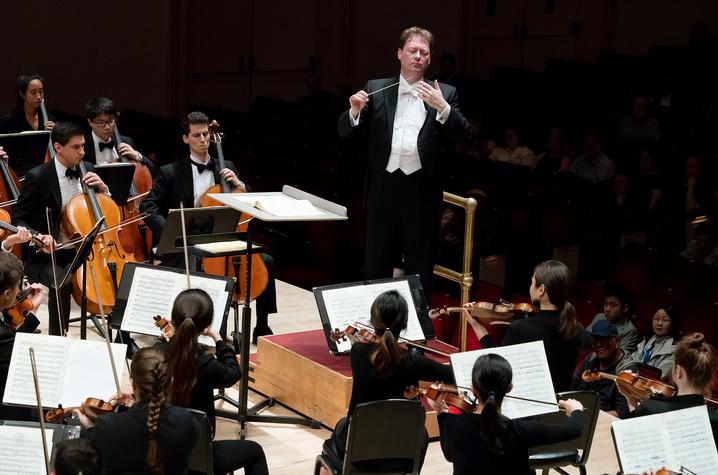 photo of John Nardolillo conducting members of UK Symphony Orchestra at Carnegie Hall