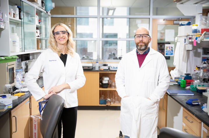 Pharmacy researchers standing in lab