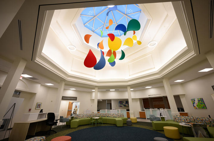 image of interior of clinic atrium with colorful mobile hanging from ceiling