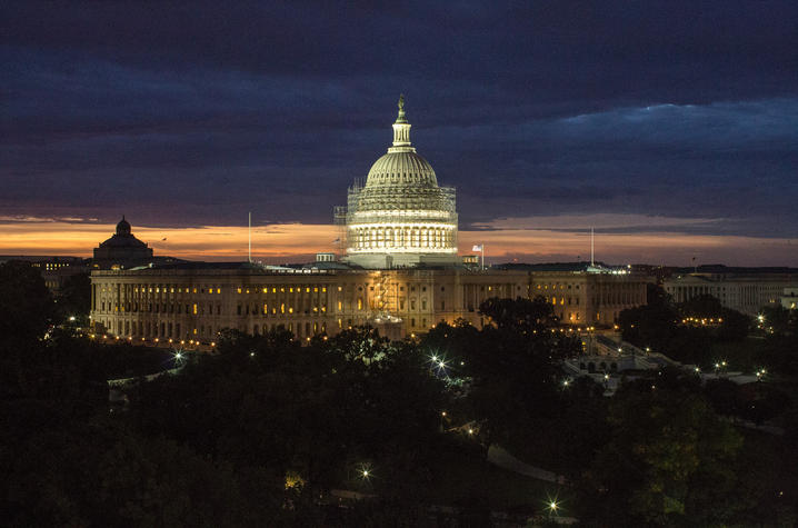photo of restoration on U.S. Capitol dome at night