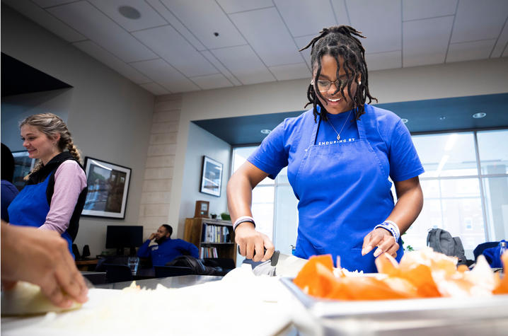 Student participates in Food Connection demonstration