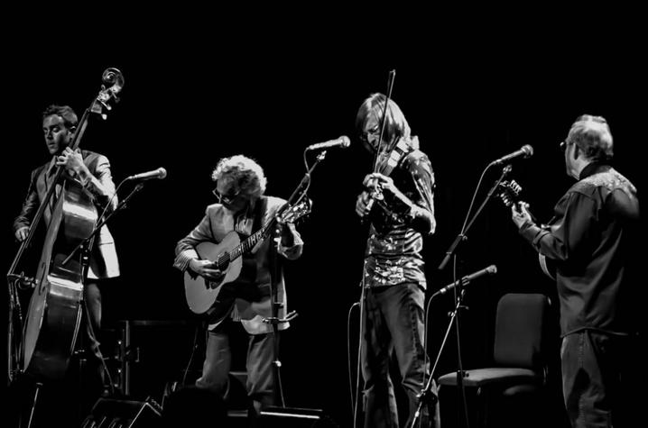 black and white photo of Sgt. Pepper's Lonely Bluegrass Band performing