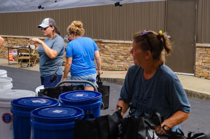 Huffman, far left, instructs volunteers