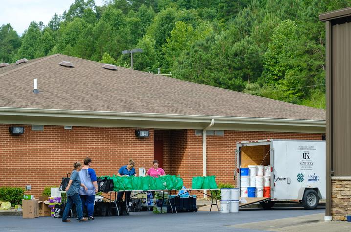 Volunteers prepare buckets and bags to hand out