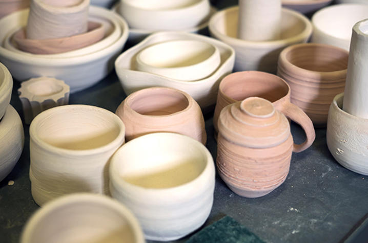 photo of ceramic bowls, mugs, vases