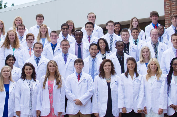 Group of medical students in white coats