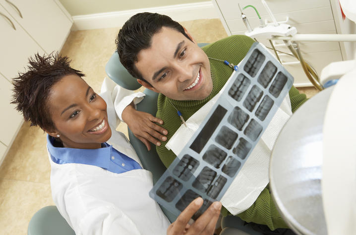 photo of dentist and patient