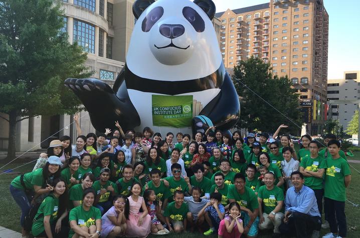photo of group with inflatable panda at child painting at Global Confucius Institute Day