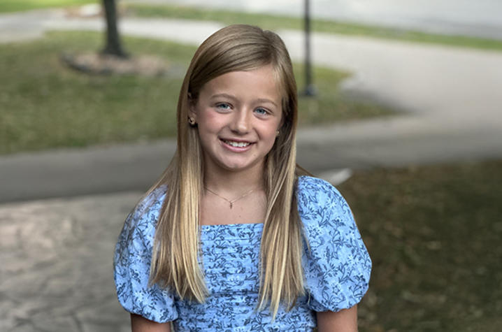 Image of Harper wearing a blue dress