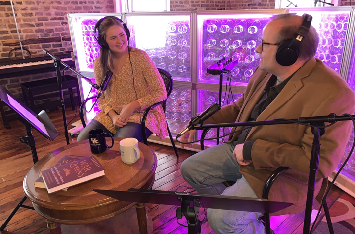 photo of student Emily Jordan recording podcast with her father