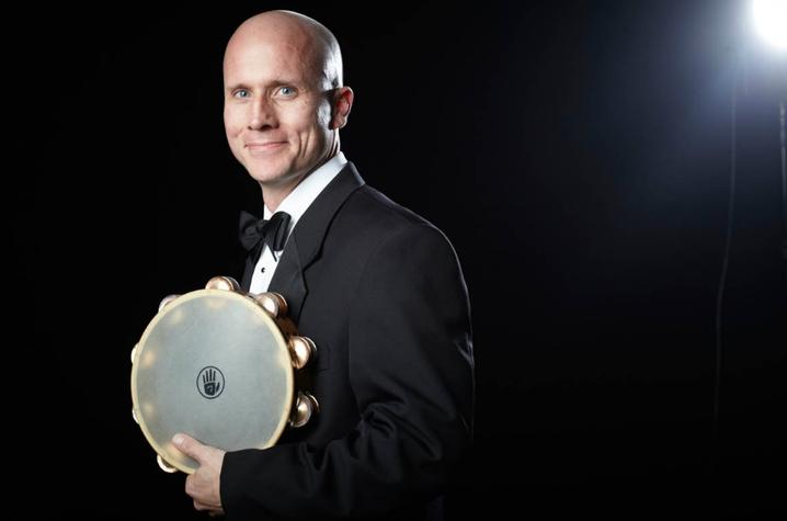 photo of Joshua D. Smith with tambourine