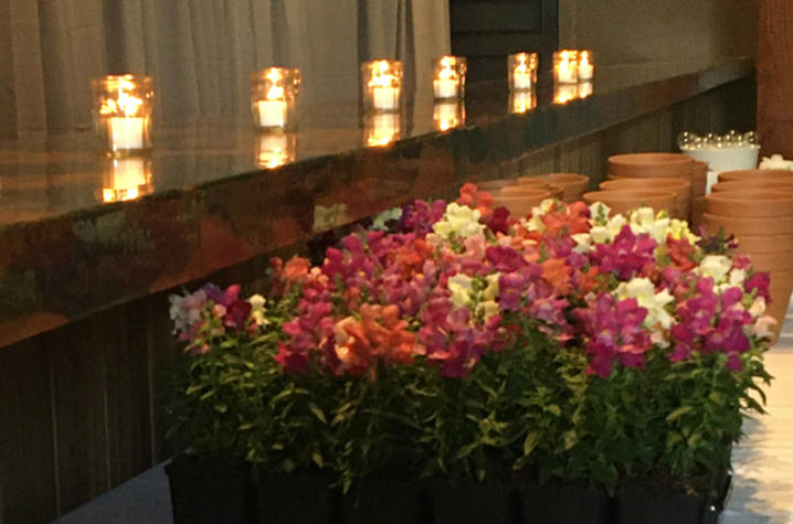 image of flowers and candles at memorial service