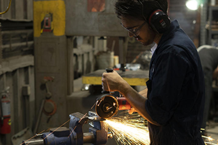 photo of male student in metalworking class