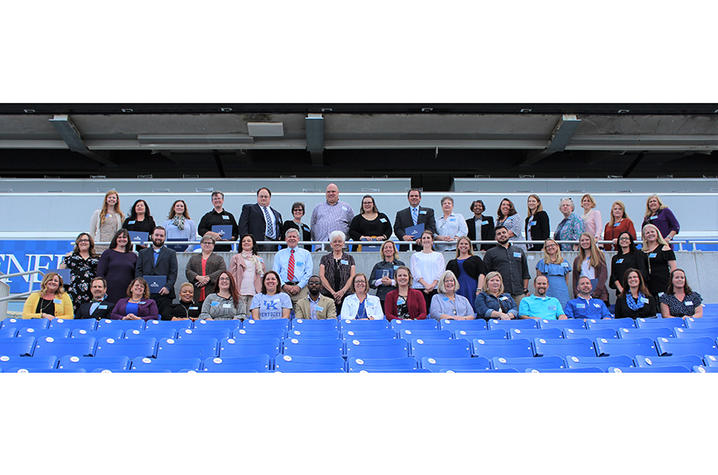 photo of award winners in stands at Kroger Field