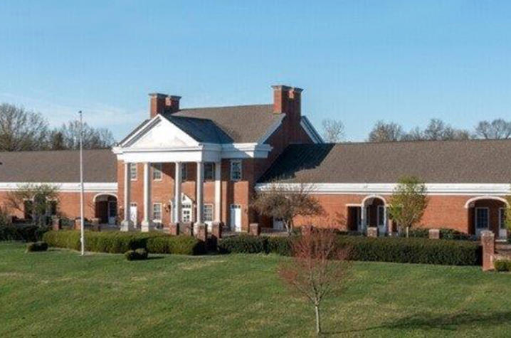 Image of brick building with white columns