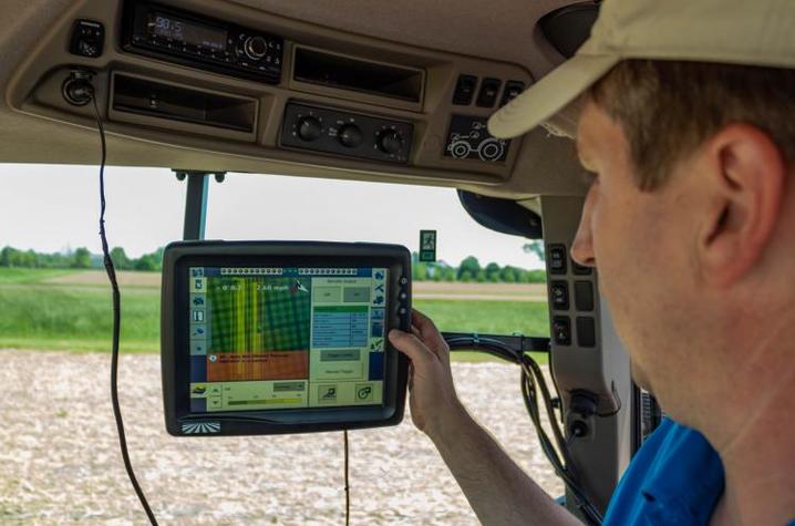 Chad Lee, director of the UK Grain and Forage Center of Excellence, monitors the planting progress of the "Sacred Acre" of corn at UK. Photo by Ginny Gregory, Kentucky Distillers' Association