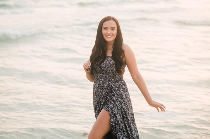 photo of Sarah Bolton walking in ocean