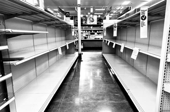 black and white photo of empty store shelves from "In This Together"